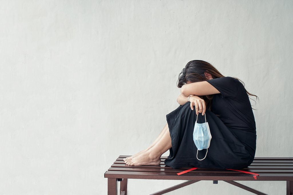 Sad,And,Stressed,Woman,With,Black,Outfit,Sitting,On,Chair